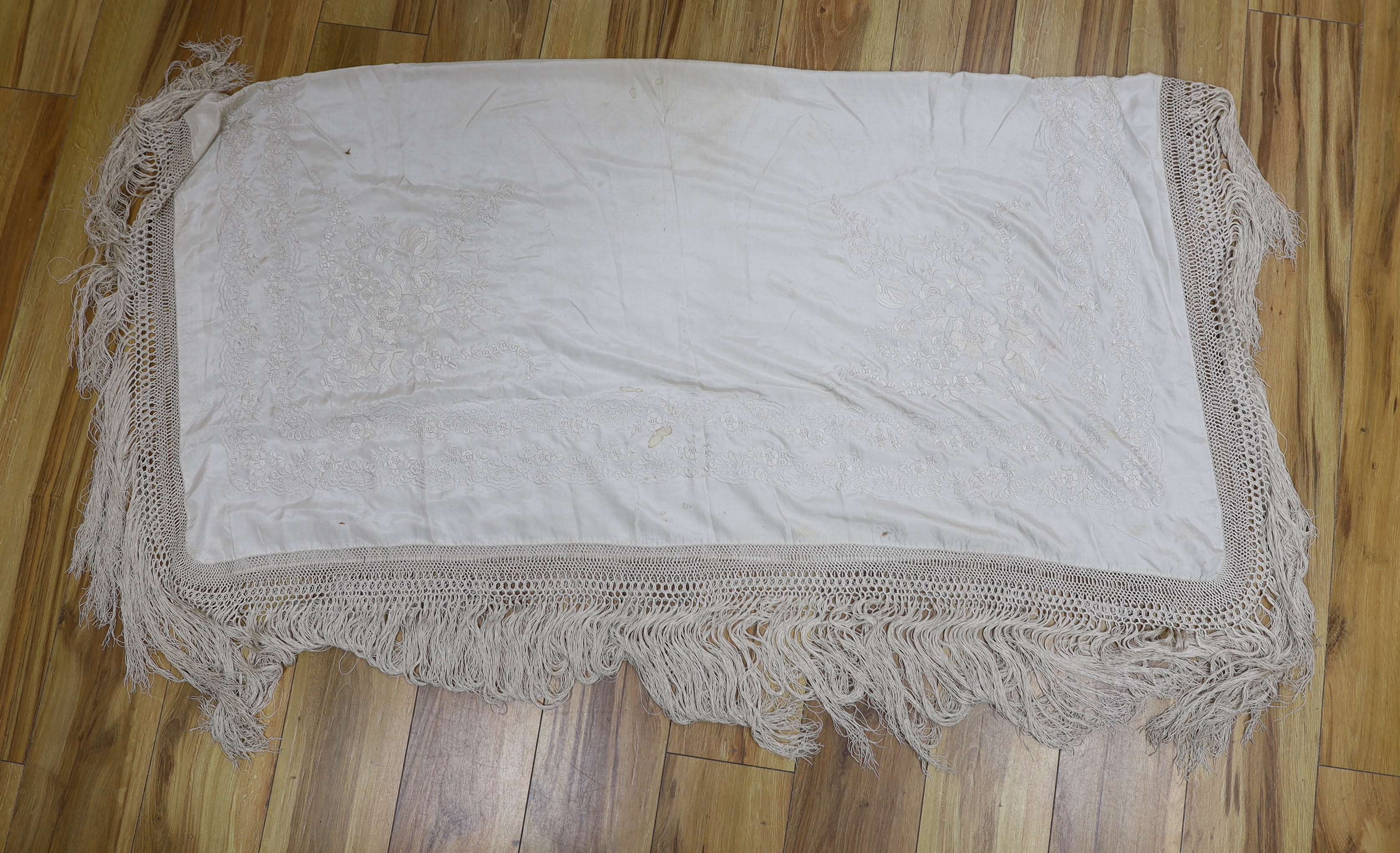 A Canton cream silk embroidered shawl, 136cm x 138cm